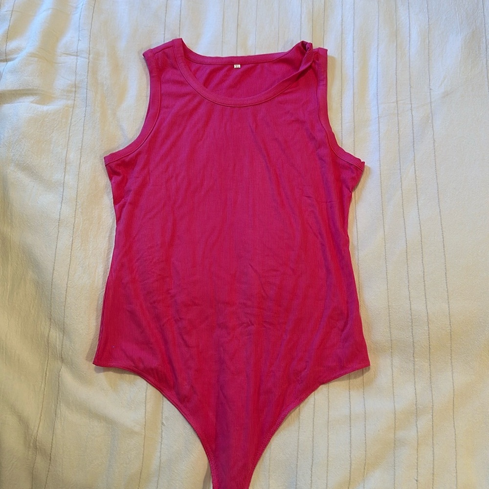 Brand new never worn pink body suit